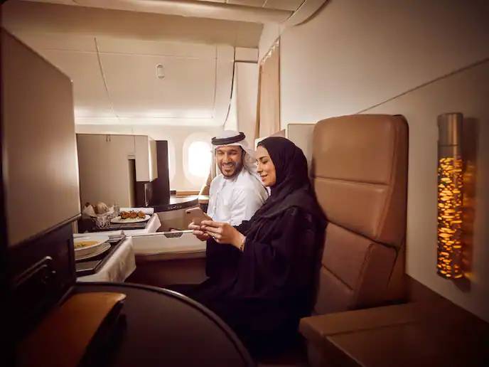 couple in business class on Etihad. 